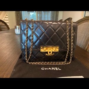 CHANEL
Black Quilted Lambskin Golden Class Bag
